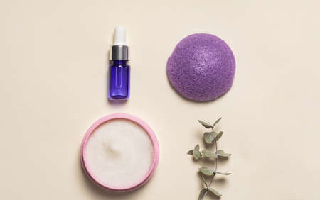 Beauty, spa and wellness concept. Facial cosmetic products, konjac sponge on a beige background. Health and medicine concept, beauty and selfcare. flat lay compositionの写真素材