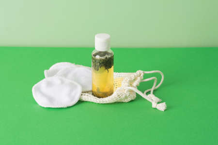 Fermented beauty product with green tea extract and eco friendly accessories, holistic beauty concept, copy spaceの写真素材
