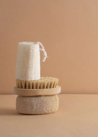 Eco friendly bathroom accessories on beige background. Beauty, sustainable and wellness concept. Verticalの写真素材