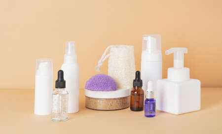 Beauty, spa and wellness concept. Facial cosmetic products, konjac sponge on a beige background. Health and medicine concept, beauty and selfcare. front viewの写真素材