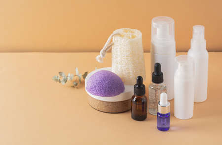 Beauty, spa and wellness concept. Facial cosmetic products, konjac sponge on a beige background. Health and medicine concept, beauty and selfcare. front viewの写真素材
