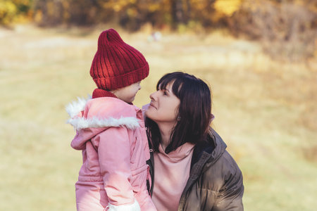Happy and smilling mother and daughter in nature. Family, parenting and healthy relationship conceptの写真素材