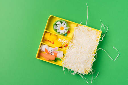 Set of decorative ornaments for the Easter holiday: rabbits, chickens, carrots, a nest with eggs. Preparing for a happy easterの写真素材