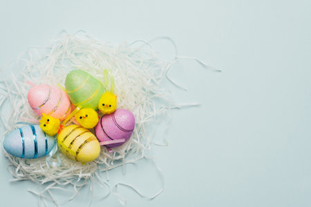 Easter composition with decorative yellow chickens and eggs. Background for your project for the...