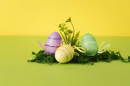 Easter composition with colorful eggs and natural materials. Background for your project for the holiday happy easterの写真素材