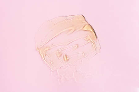 Liquid gel cosmetic product with bubbles on pink background. cosmetic product textureの写真素材