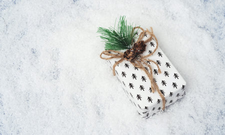 Christmas white gift box on the snowの写真素材
