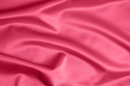 Textured background of red silk or satin. Color of the Year 2023の写真素材