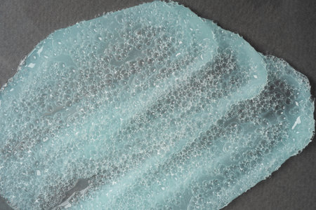 Close-up cosmetic product with bubble texture. Smear of cosmetics for face and bodyの写真素材