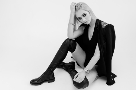 High fashion look.glamor portrait of beautiful sexy stylish Caucasian young woman model in black clothの写真素材