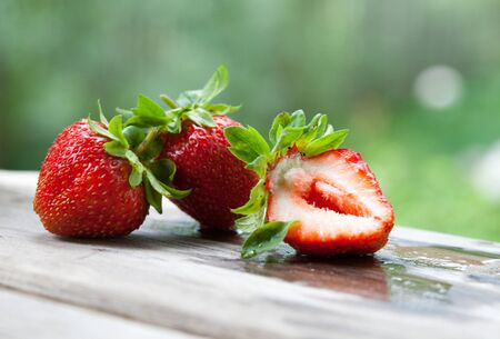 Some fresh strawberries on the boardの写真素材