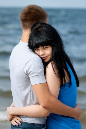 loving young couple is embracing at sea の写真素材