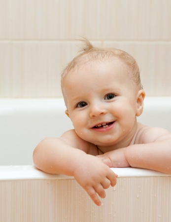 Little boy smiles in the bathroomの写真素材