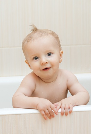 Little boy smiles in the bathroomの写真素材
