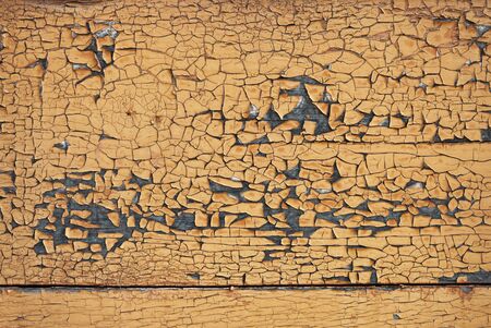 Old cracked brown paint boards backgroundの写真素材