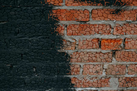 red brick wall texture painted with black primer.の写真素材