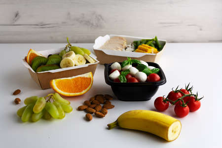 Different types of takeaway food on a light background