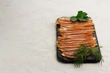 Jerky meat on a slate with copy spaceの写真素材