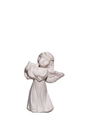 White standing angel statue with wings isolated on white backgroundの写真素材