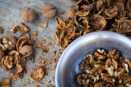 Walnuts kernels with color background, Whole walnut in a metal plate. Walnuts. Walnuts an market. Background of walnuts. Healthy. Freshの写真素材