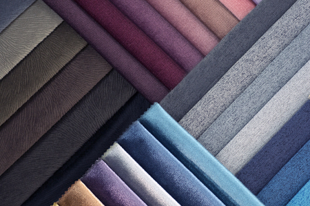 Catalogue of multicoloured cloth from matting fabric texture background.
