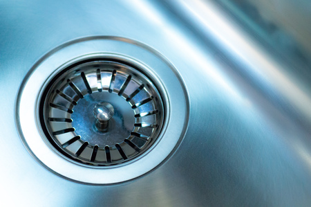 Stainless steel sink with drain. Closeup. Modern style chrome A stainless steel kitchen sink drainの写真素材