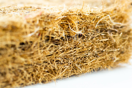 Coconut coir. Grated coconut shell for the production of mattresses. texture, natural background. Coconut coir pressed at the factory. Background of coconut fiber.の写真素材