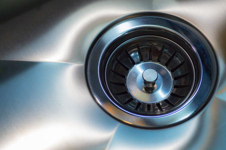 Stainless steel sink with drain. Closeup. Modern style chrome A stainless steel kitchen sink drainの写真素材