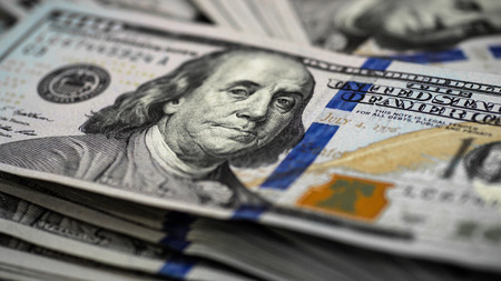 Macro shot of a 100 dollar. Dollars Closeup Concept. American Dollars Cash Money. One Hundred Dollar Banknotes. Hundred Bucks. Benjamin Franklin's portrait.の写真素材