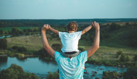 Happy loving family. Father and his son baby boy playing and hugging outdoors. Concept of Father's day.の写真素材