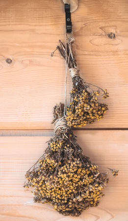 Bouquet of dried flowers on a vintage cafe background. Vintage decoation for cafe and restaurant.の写真素材