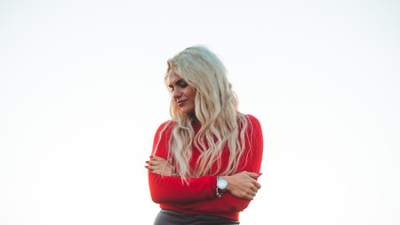 Beauty Romantic Girl Outdoors enjoying nature. Beautiful autumn model with waving glow hair. Sun light on sunset. Portrait of romantic femaleの写真素材