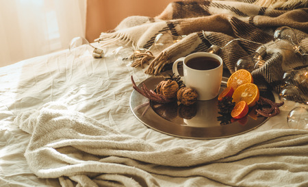 Christmas still life with cup with tea or coffee, cookies in the shape of snowflakes, oranges with christmas decorations and nuts. Christmas concept. Cozyの写真素材
