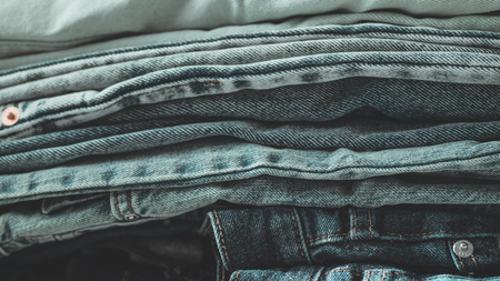 Jeans background.Jeans on a light background. Detail of nice blue jeans. Jeans texture or denim background. Blue denim jeans texture.の写真素材