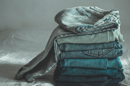 Jeans background.Jeans on a light background. Detail of nice blue jeans. Jeans texture or denim background. Blue denim jeans texture.の写真素材