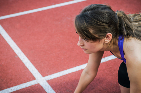 Fitness sport girl in fashion sportswear doing yoga fitness exercise in the street, outdoor sports, urban style. Healthy lifestyle concept.の写真素材