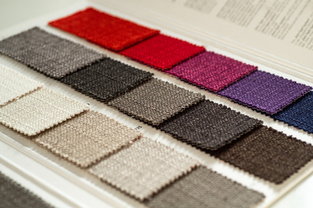 Catalog of multicolored cloth from matting fabric texture background, silk fabric texture, textile industry background.の写真素材