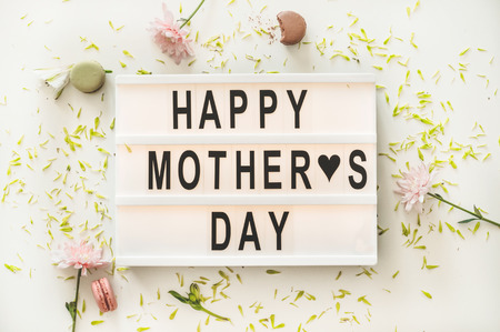Happy mothers day. A beautiful bouquet of flowers with hot tea on the table. Breakfast in bed on...