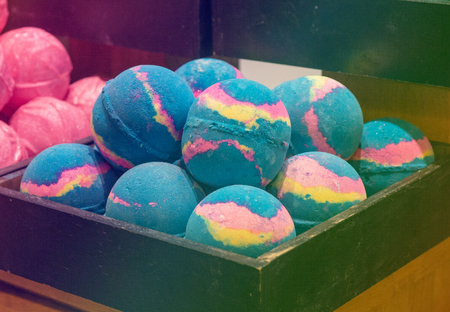 Shop cosmetic handmade bombs and bubble bath different colors. The concept of Spa and relaxationの写真素材