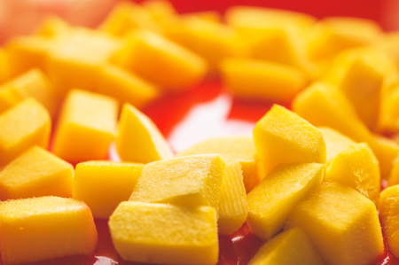 Red cake background with mango. Close up of red cake background. Fresh cake background.の写真素材