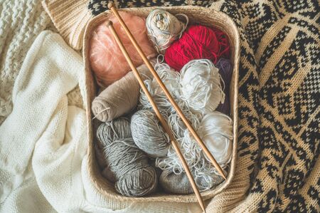 Thread for knitting in a basket closeup. Knitting as a hobby. Accessories for knitting.の写真素材