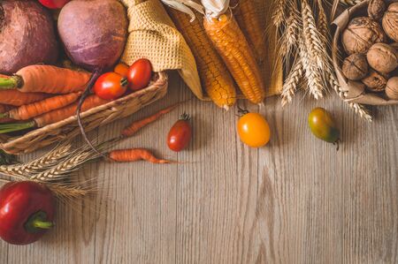 Harvest, Autumn. Still life with Thanksgiving concept. Panoramic collection of fresh healthy fruits and vegetables. Healthy eating background. Vegetables on vintage rustic wooden background.の写真素材