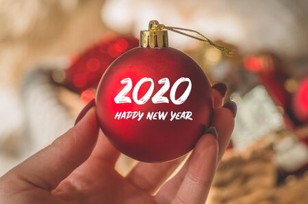 Merry Christmas and happy New year. Christmas tree toys in hands women. Winter mood, holiday...