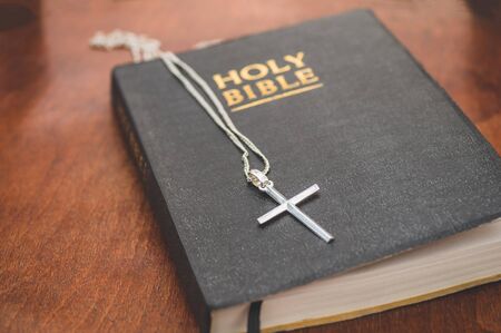 The Bible and the cross. Concept for faith, spirituality and religion. Peace, hope, dreams concept