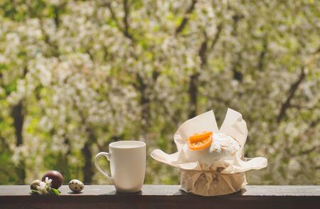 Happy Easter. Congratulatory easter background. Easter cake with easter eggs on a wooden window...
