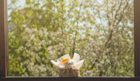 Happy Easter. Congratulatory easter background. Easter cake with easter eggs on a wooden window sill. Holiday Conceptの写真素材