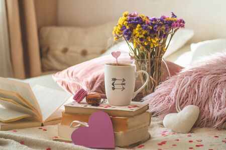 Happy Valentines Day postcard. Love concept for mothers day and valentines day. Hearts and the books...