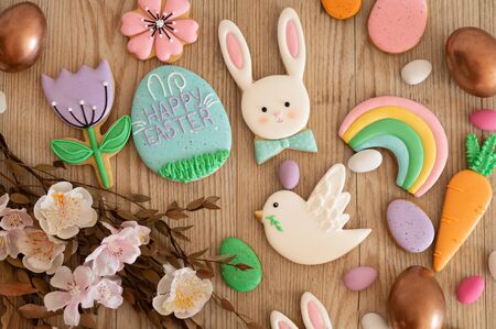 Happy Easter. Multicolored pastel easter cookies on a white background. Easter concept
