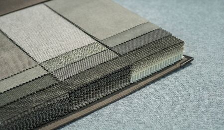 Upholstery fabric samples. Fabric for a furniture upholstery. Textile industry background.