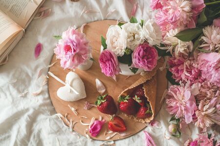 Still life details in home interior of living room. Cup and Book spring decor on the books. Read, Rest. Cozy spring Summer concept.の写真素材